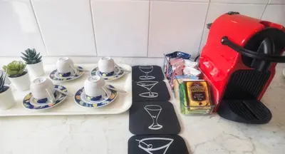 a kitchen counter with two measuring cups and saucers at Millelire Vatican Terrace in Rome
