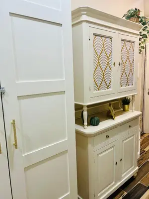 a closet with white cabinets and a door at SD Vatican Rooms in Rome