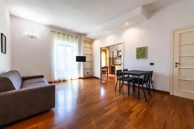 a living room with a couch and a table at Re di Roma Lodge in Rome