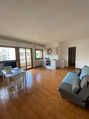 a living room with a couch and a table at Saluzzo Apartment in Rome