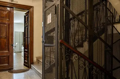 an entrance to a room with a iron gate at St Peter Family Stay in Rome