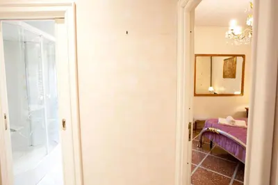 a door leading into a room with a mirror at Francesca e Anita in Rome