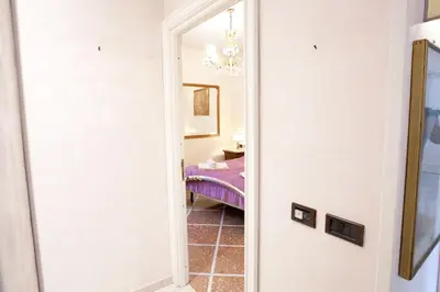 a hallway with a mirror in a room at Francesca e Anita in Rome