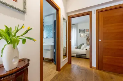 a hallway with a door leading to a bedroom at Elegant Escape near the Vatican in Rome