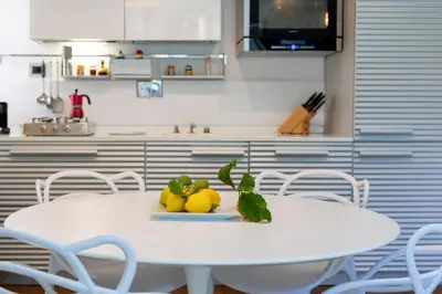 a white table with lemons on it in a kitchen at Elegant Escape near the Vatican in Rome