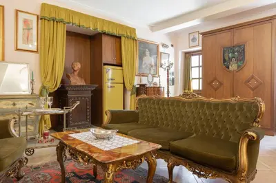 a living room with a couch and a table at Loft Appia Antica Donna Eugenia in Rome