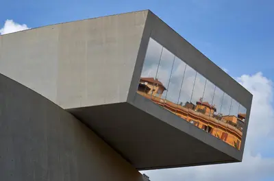 a reflection of a building in the windows of a building at Casa Ponte della Musica in Rome