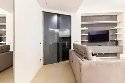 a living room with a couch and a tv at Vatican Flat in Rome