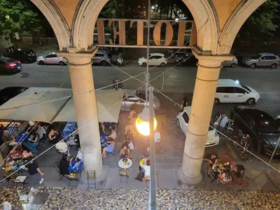 a group of people sitting at tables in a building at Rome Jubilee Stays in Rome