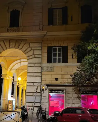 a red car parked in front of a building at Rome Jubilee Stays in Rome