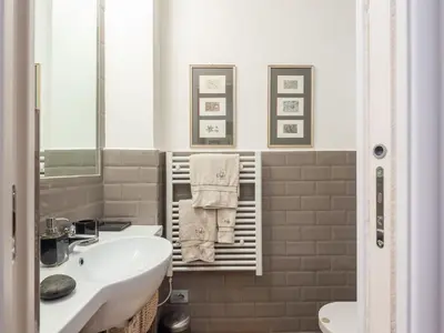 a bathroom with a sink and a toilet at Apartment Tiziano by Interhome in Rome