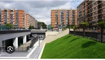 a city with tall buildings and a green lawn at Casa Carlotta a Roma in Rome