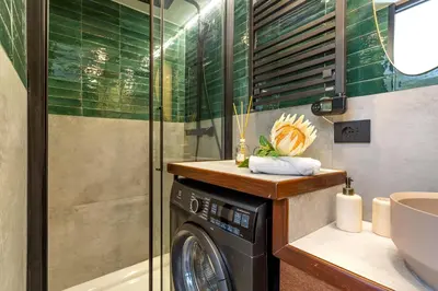 a washing machine in a bathroom with a sink at iFlat Campo de' Fiori modern apartment in Rome