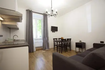 a living room with a couch and a table at Milizie Holiday House in Rome