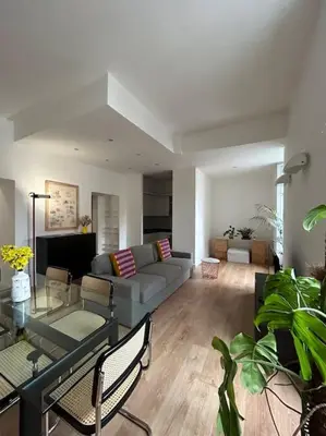 a living room with a couch and a table at Cozy apartment- 100 meters from Vatican in Rome