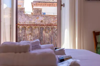a room with a bed and a window with a view at iFlat Peaceful apt with terrace next to Vatican in Rome