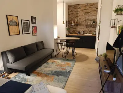 a living room with a couch and a table at Think House in Rome