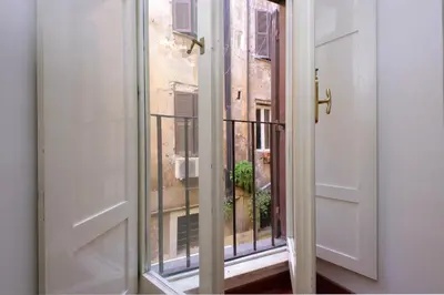 an open door with a view of a balcony at Cappellari37 in Rome