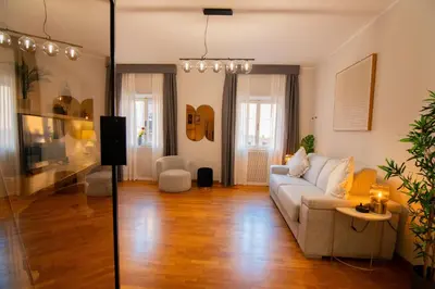 two pictures of a living room with a couch at Bruno Domus Design in Rome
