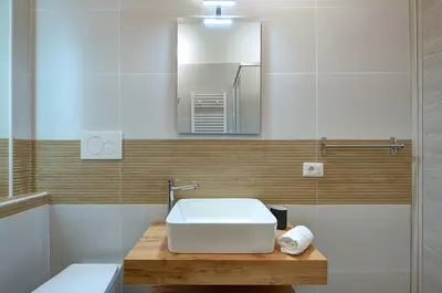 a bathroom with a white sink and a mirror at Vatican Pop House in Rome
