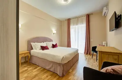 a hotel room with a bed and a window at Vatican Pop House in Rome