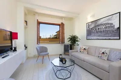 a living room with a couch and a table at Appartamento Vatican Terrace in Rome