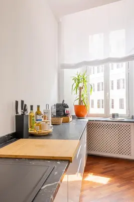 a kitchen with a counter top and a window at Cavour 211 - B&D Apartments in Rome