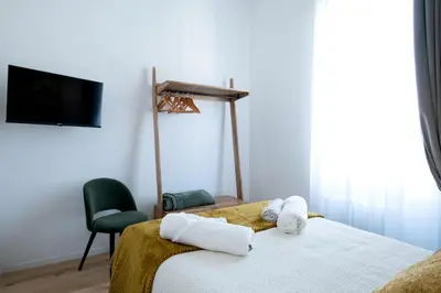 a bedroom with a bed with towels on it at LV Vatican boutique apartment in Rome