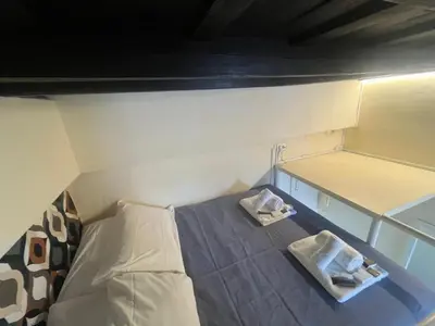 a small room with a bed in a small room at Casa Lella al Borgo Pio, a pochi passi da San Pietro in Rome