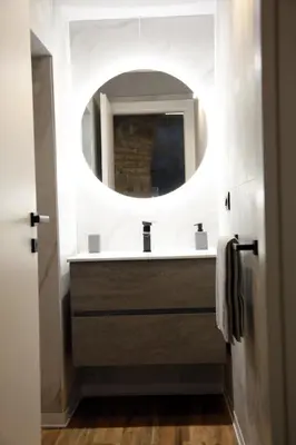 a bathroom with a sink and a mirror at Unique Trastevere in Rome