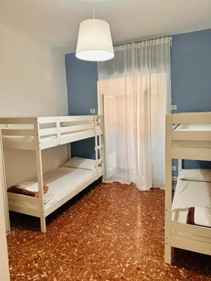 a room with two bunk beds and a lamp at Baraka 24 in Rome