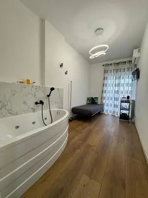 a large white bath tub in a room at B&B Behind the Vatican in Rome