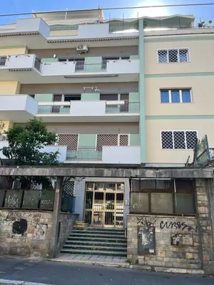 a building with stairs in front of it at Ginevra Apartment in Rome in Rome