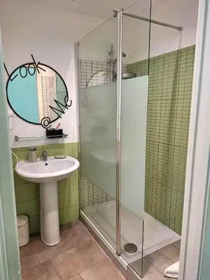 a bathroom with a sink and a glass shower at Re di Roma nice rooms in Rome