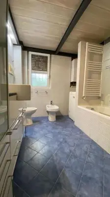 a bathroom with a toilet and a sink in it at Caffa Apartment in Rome