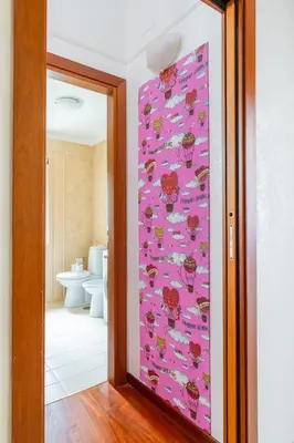 a bathroom with a pink door in a room at maison Trevi in Rome