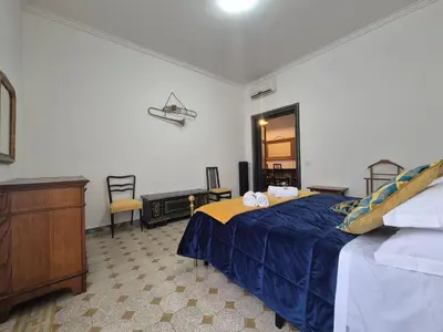 a bedroom with a bed and a dresser in it at Casa di Bea in Rome