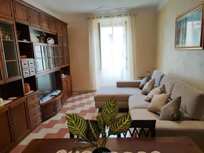 a living room with a couch and a table at Iannilli Casa Vacanze in Rome