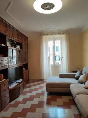 a living room with a couch and a tv in it at Iannilli Casa Vacanze in Rome