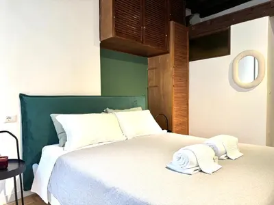a bedroom with a bed with two towels on it at Luxury Apartment Historic Center in Rome