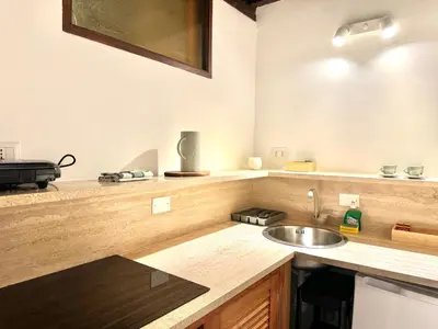 a kitchen with a sink and a counter at Luxury Apartment Historic Center in Rome