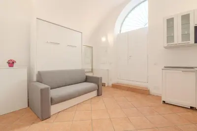a living room with a couch and a window at Cozy Rhome in Rome