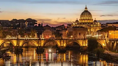a view of a bridge over a river with a cathedral at Cozy Rhome in Rome