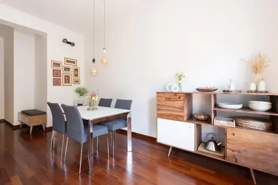 a dining room with a table and chairs at Domus La Conca in Rome