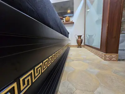 a hallway with a wall withcriptions on it at The Etrurian Rapsody in Rome