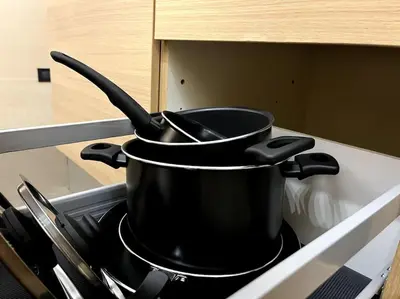 a black pot sitting on top of a stove at Oasi Floreale - Roma Termini in Rome