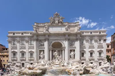 a large building with a fountain in front of it at Luxury Suite Trevi in Rome