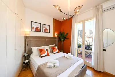 a bedroom with a large bed with towels on it at Navona design rooftop in Rome