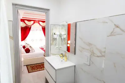 a bathroom with a sink and a mirror at La Dolce Casa in Rome