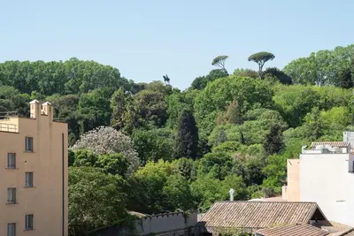 a view of a hill with trees and a building at Sales - FromHometoRome in Rome